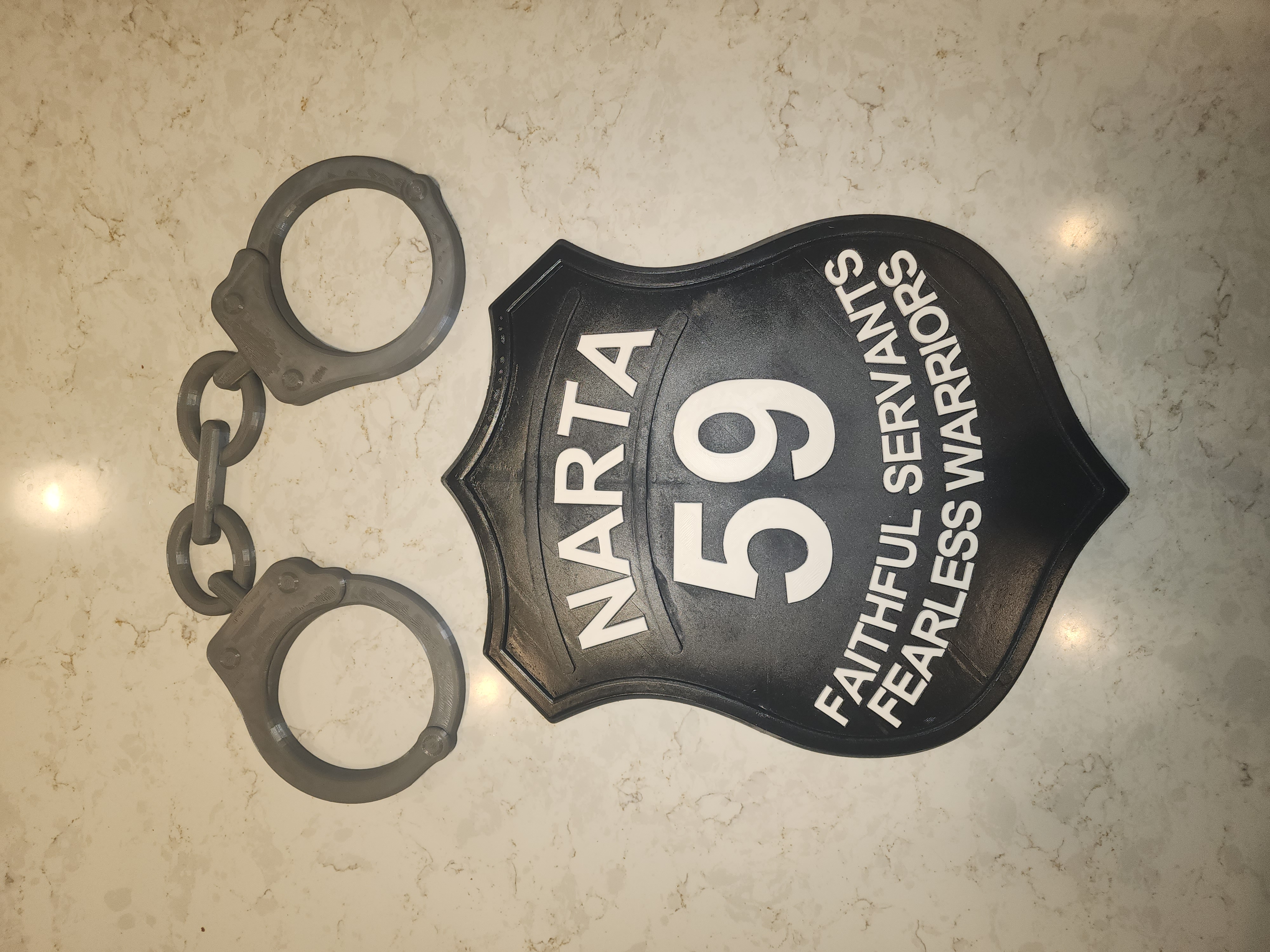 Black and white custom NARTA 59 sign with handcuffs